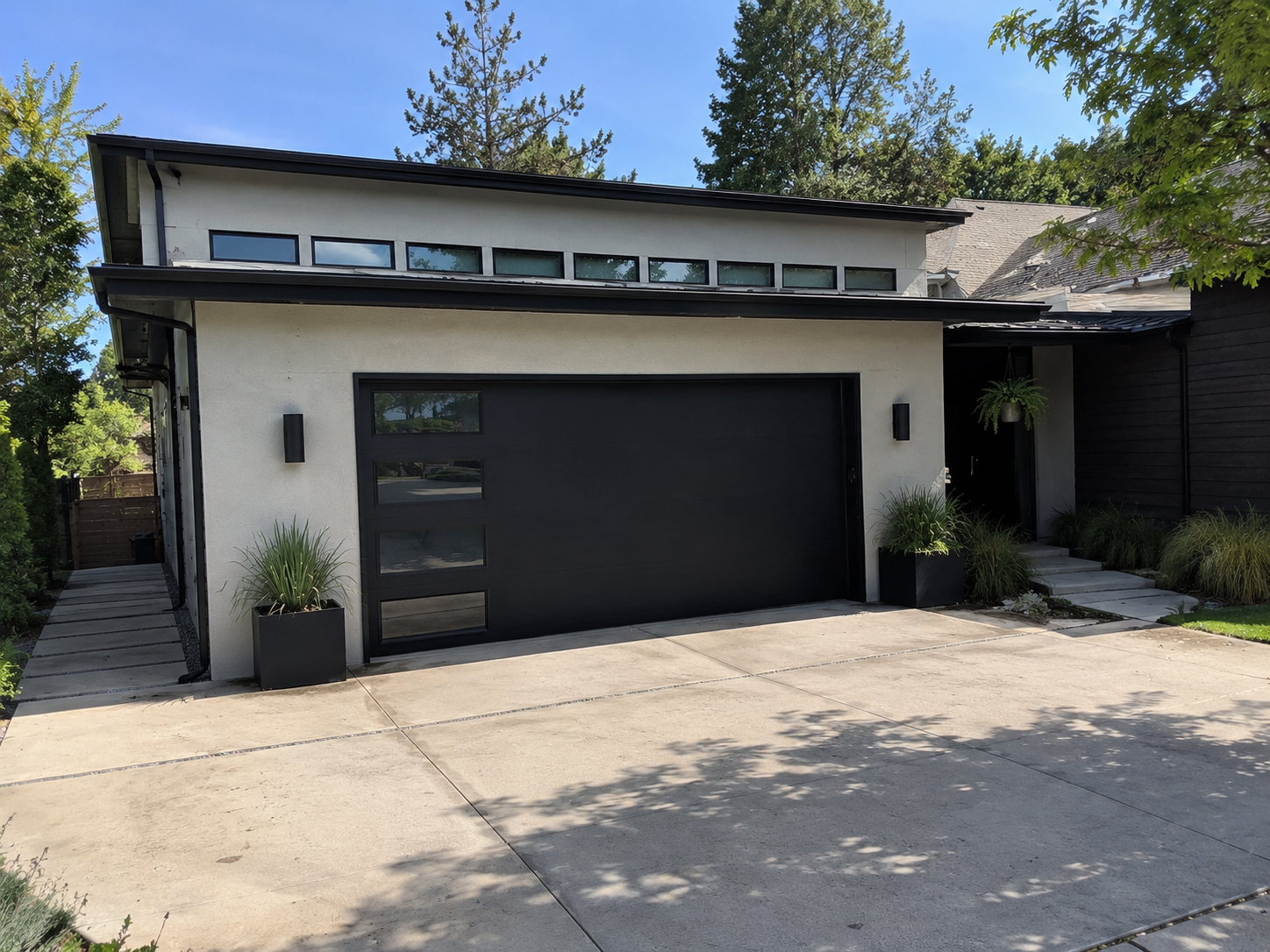 Contemporary black steel garage door on a new-construction home in a Dublin Ranch subdivision in the Tri-Valley